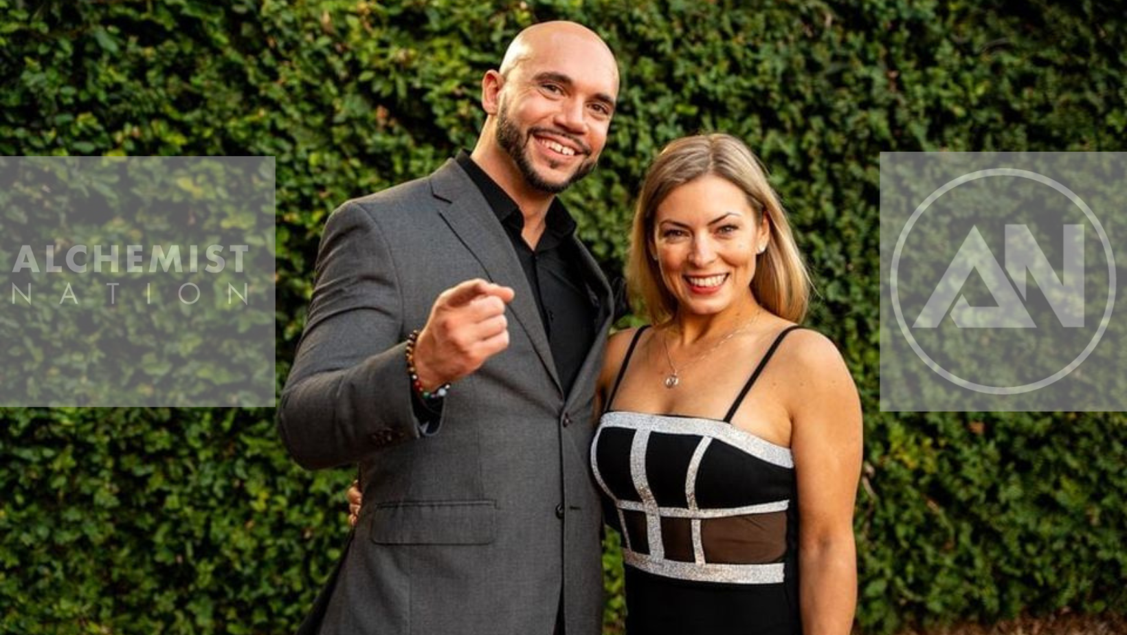 Gualter Amarelo and Darina Pogodina, photographed against the Alchemist Nation community backdrop